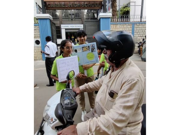 CREATING AWARENESS ABOUT WEARING HELMET 1